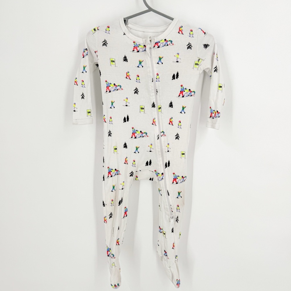 Cozy White Footie Pajamas with Skiing Motifs